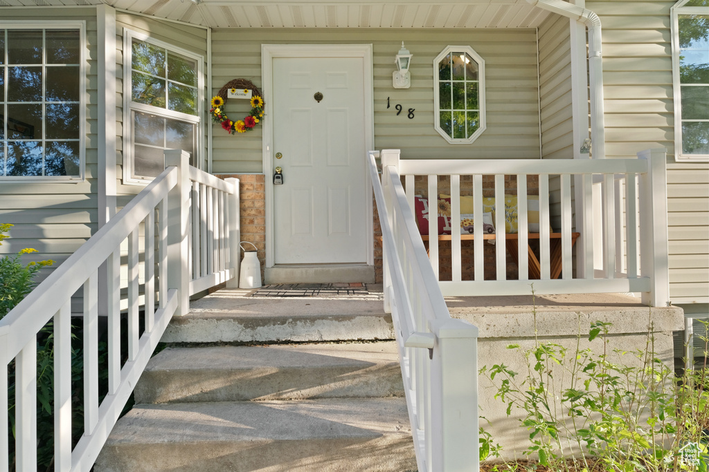 Entrance to property featuring a porch