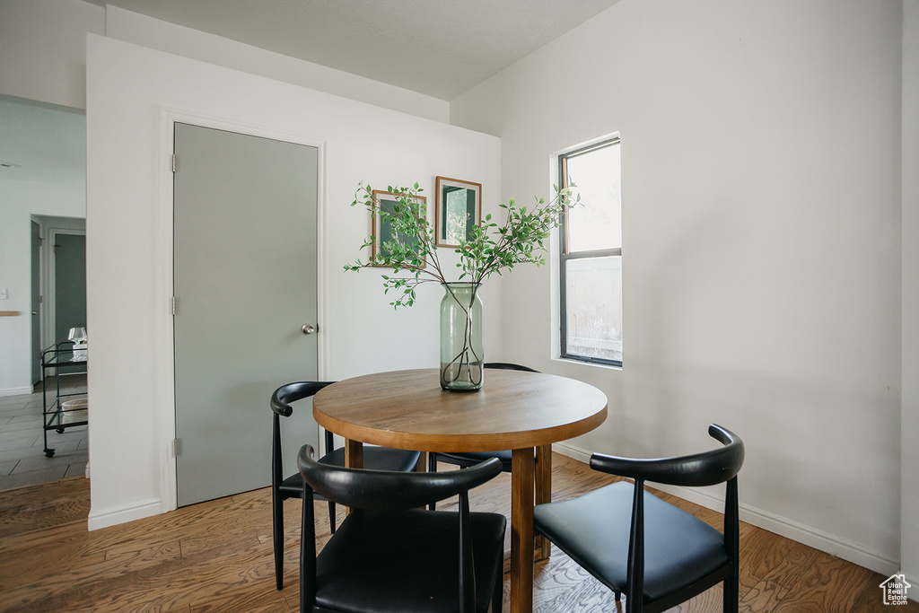 Dining room with hardwood / wood-style flooring