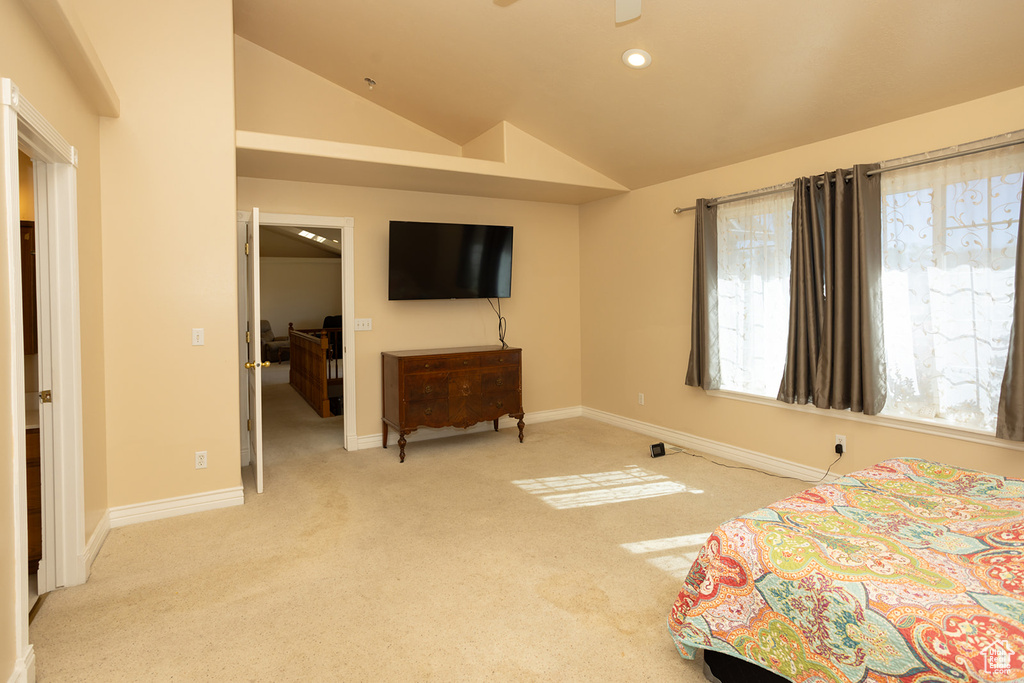 Carpeted bedroom with vaulted ceiling