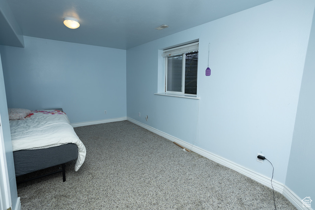 Bedroom with carpet flooring