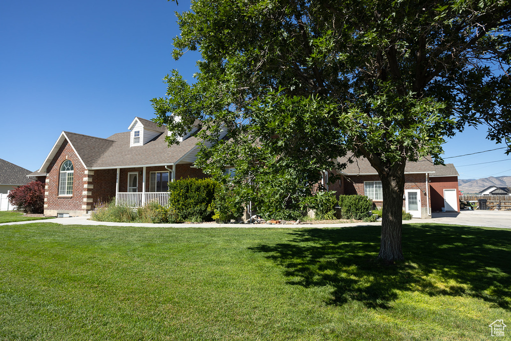 View of front of property with a front lawn