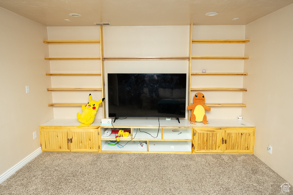 Unfurnished living room with carpet floors