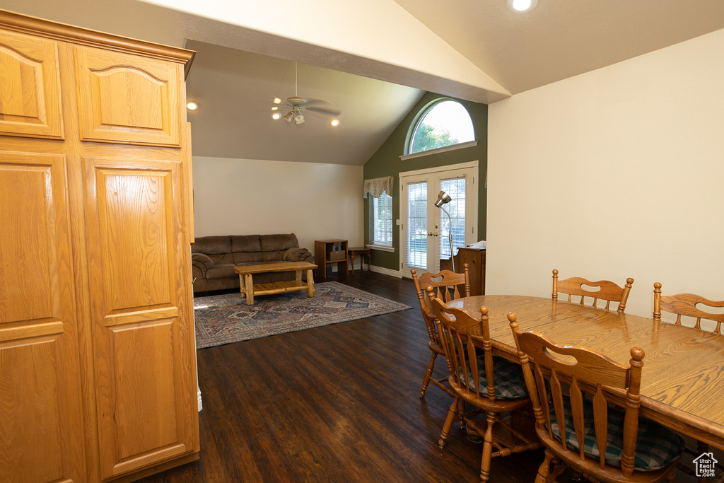 Dining area featuring ceiling fan, french doors, dark hardwood / wood-style flooring, and lofted ceiling