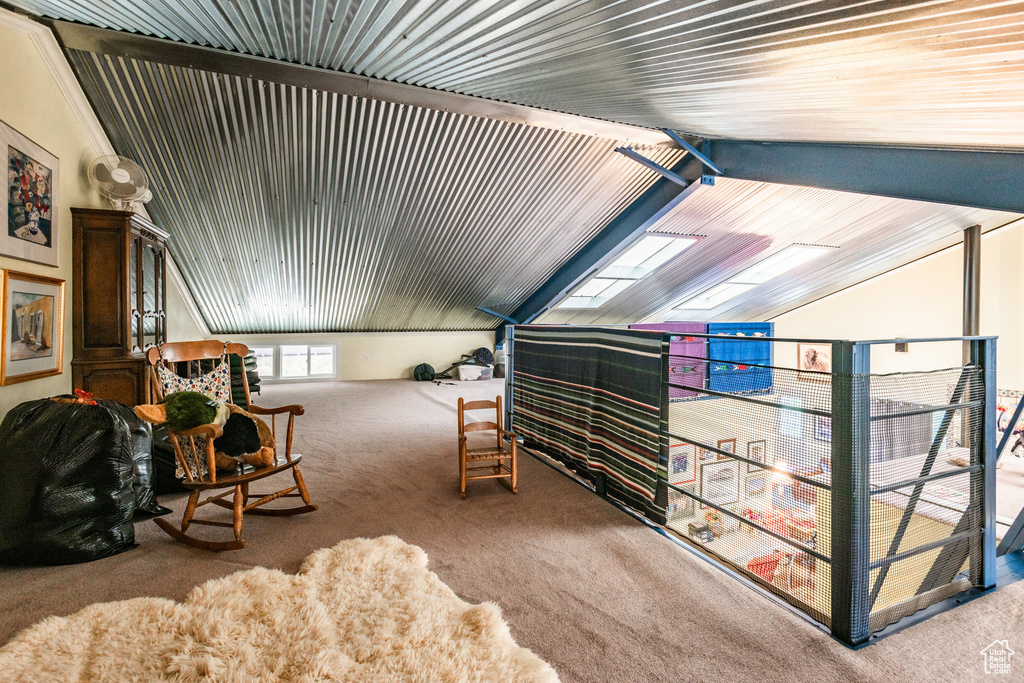 Bedroom with carpet and lofted ceiling with skylight