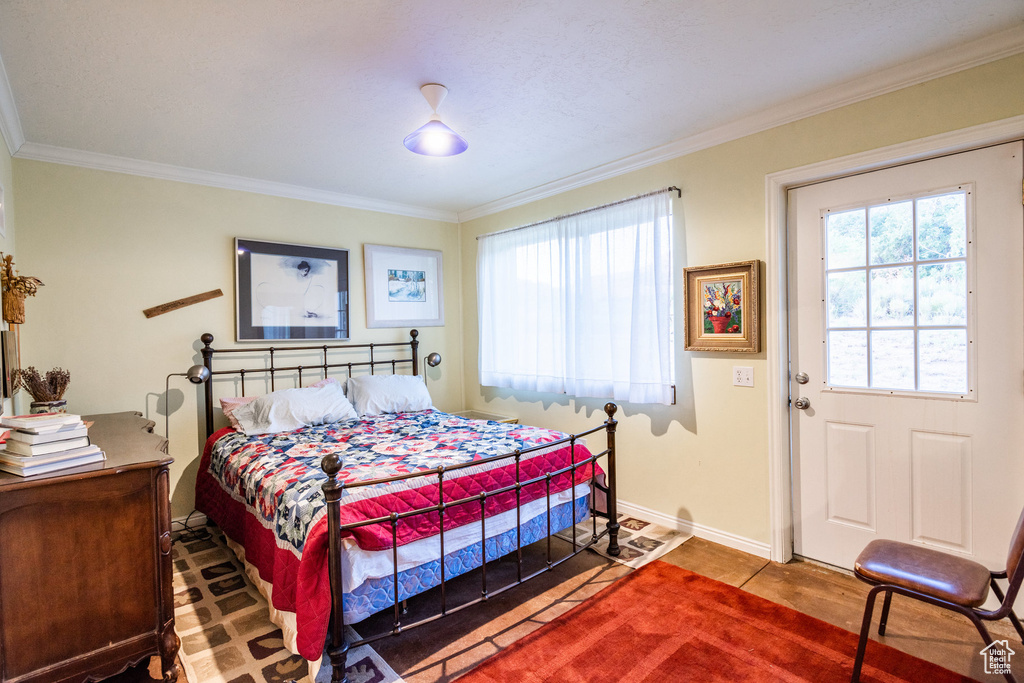 Bedroom featuring crown molding