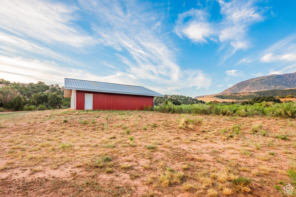 Exterior space featuring a mountain view and an outbuilding