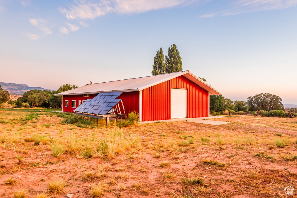 View of outbuilding with a garage