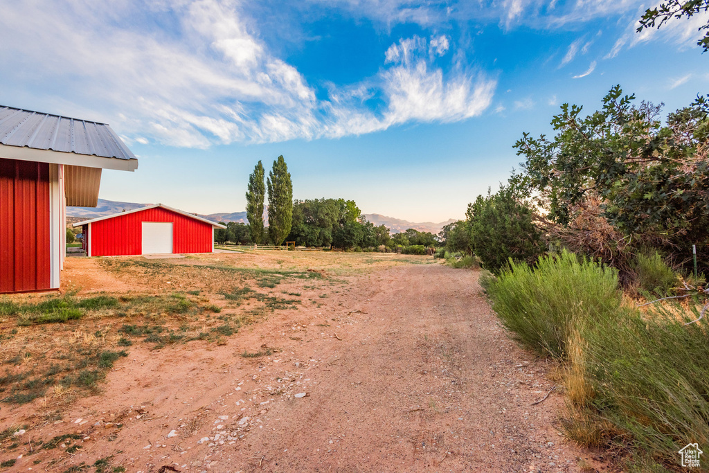 View of yard with an outbuilding