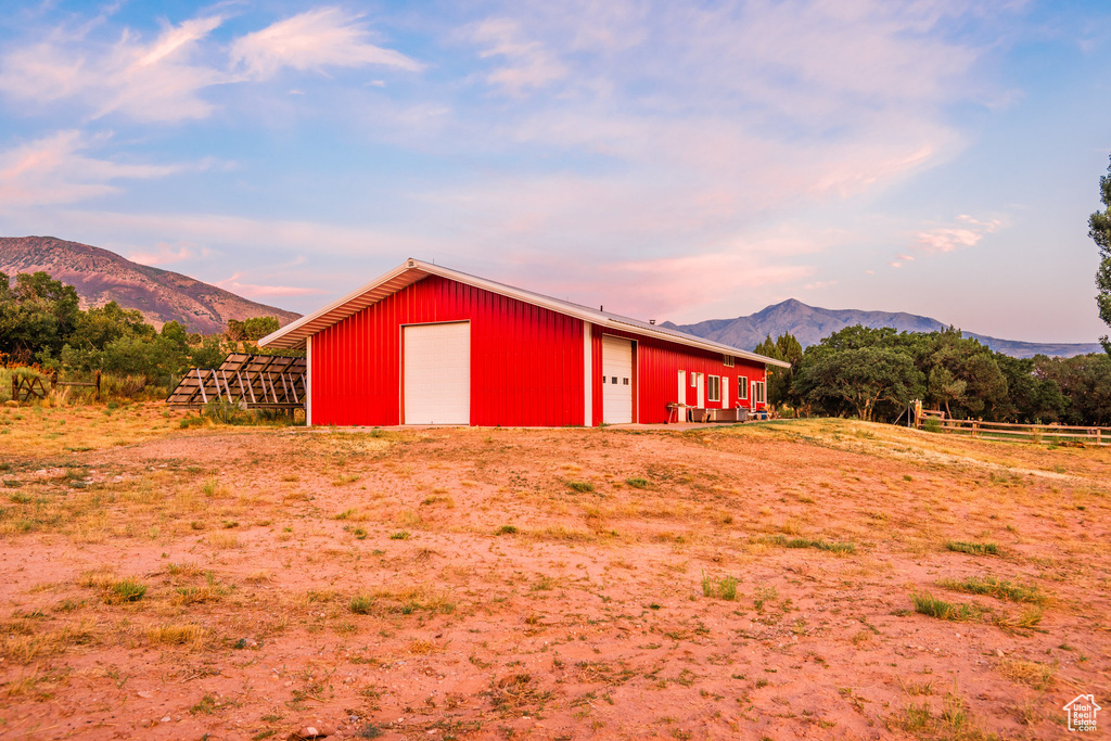 View of outdoor structure with a garage and a mountain view