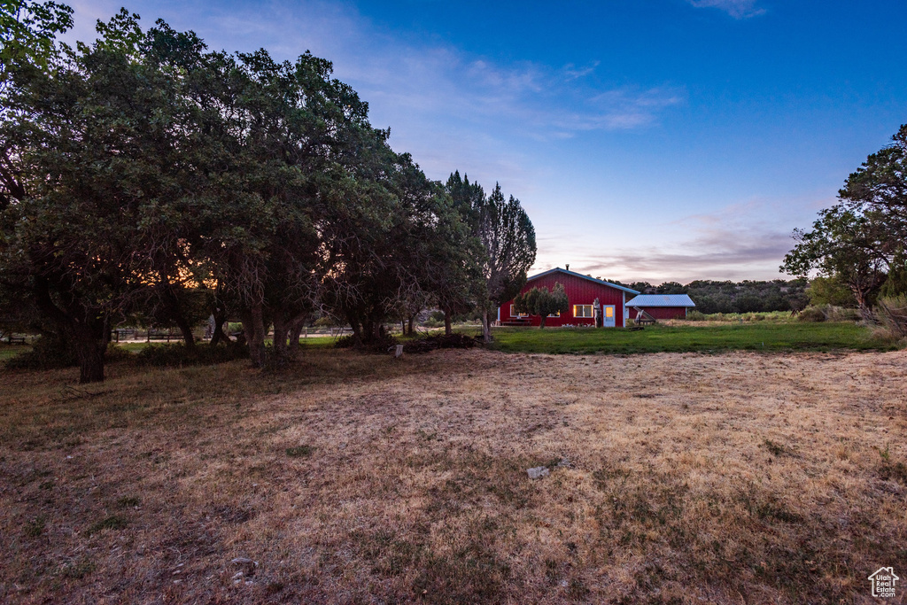 View of yard at dusk