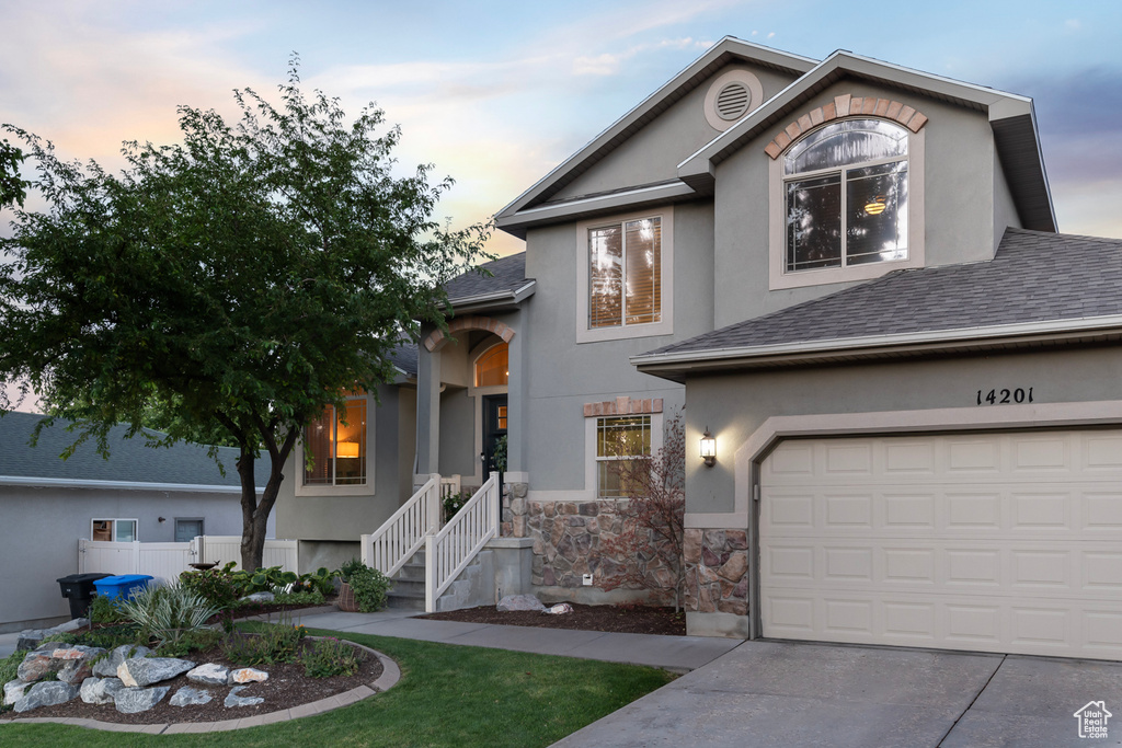 View of front of home with a garage