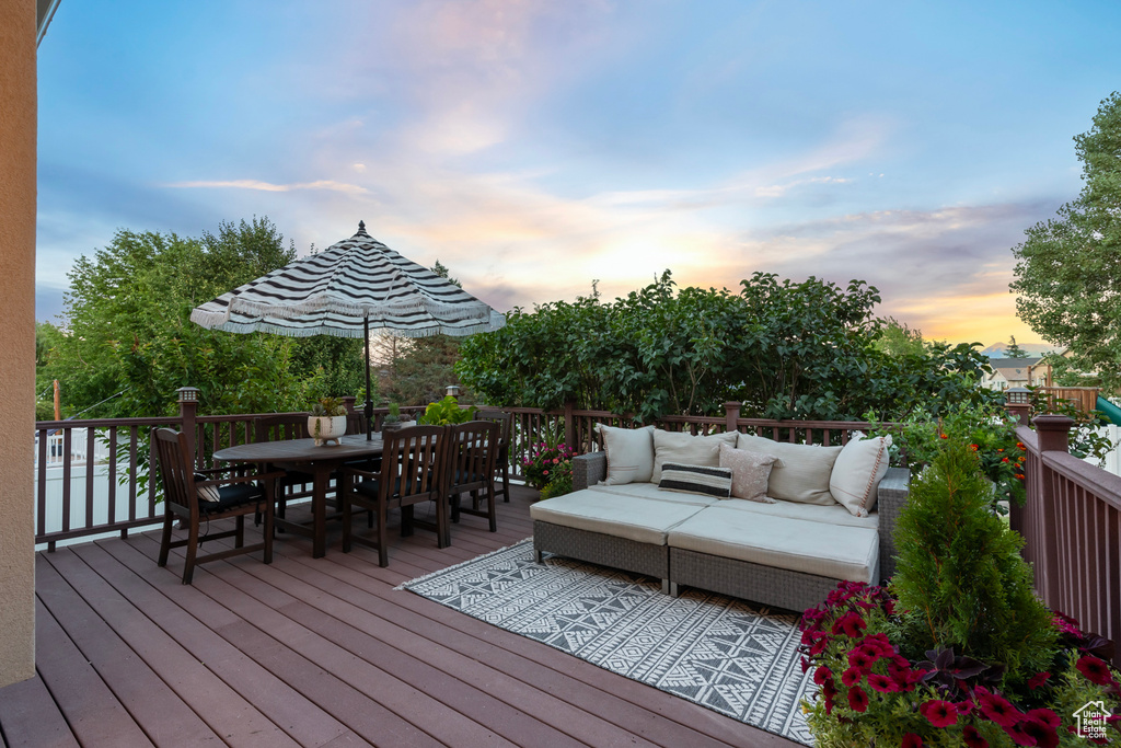 Deck at dusk with an outdoor hangout area