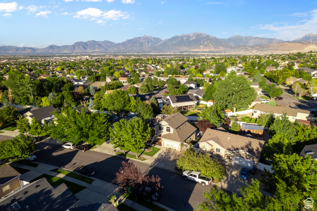 Birds eye view of property with a mountain view