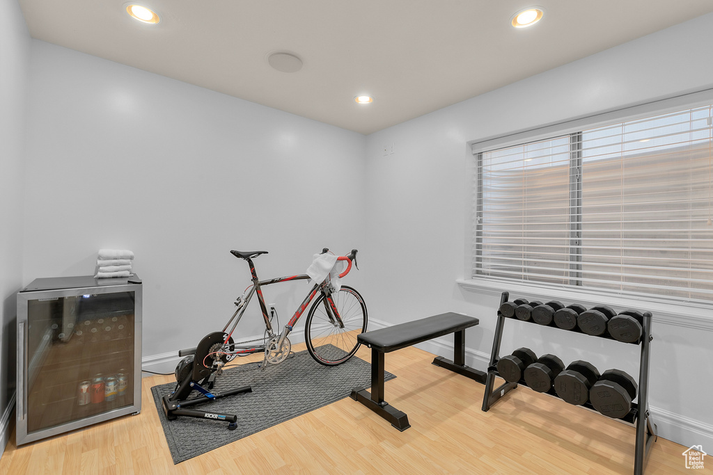 Exercise room with hardwood / wood-style flooring