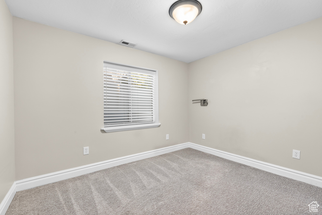 Unfurnished room featuring carpet floors