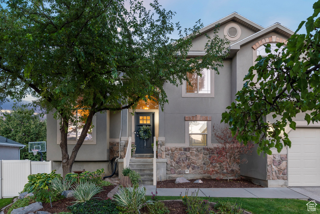 View of front of property featuring a garage