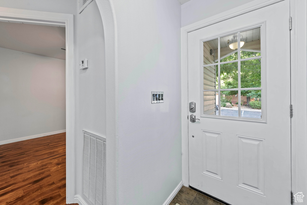 Entryway featuring dark wood-type flooring