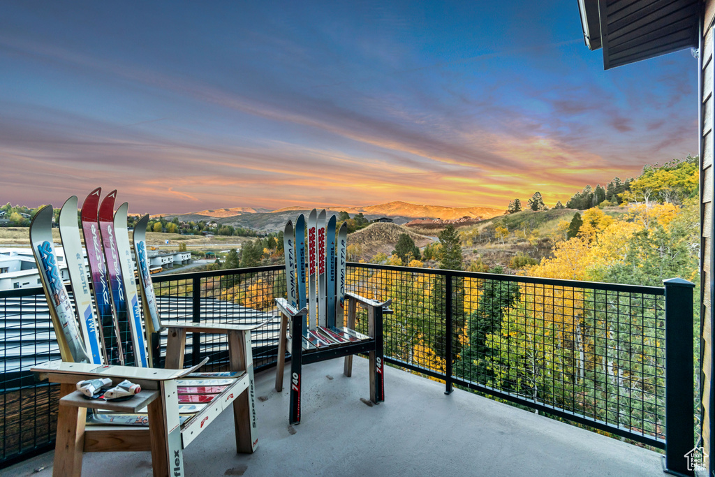 Balcony at dusk with a mountain view