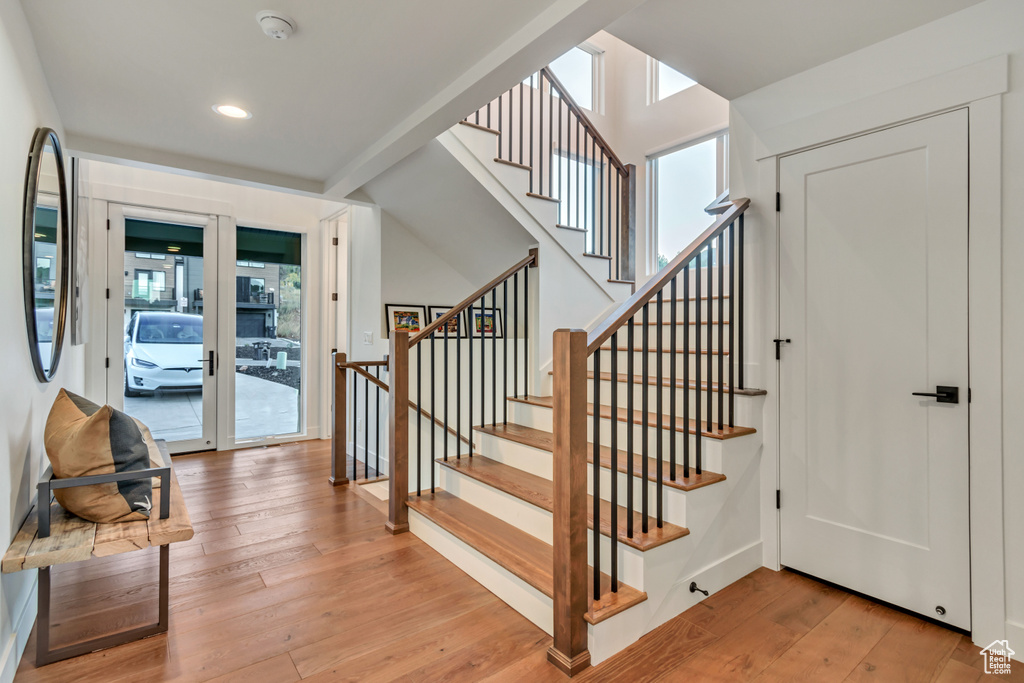 Interior space with hardwood / wood-style floors, french doors, and a healthy amount of sunlight