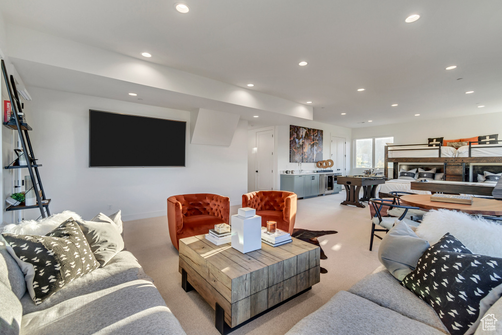 Carpeted living room with sink