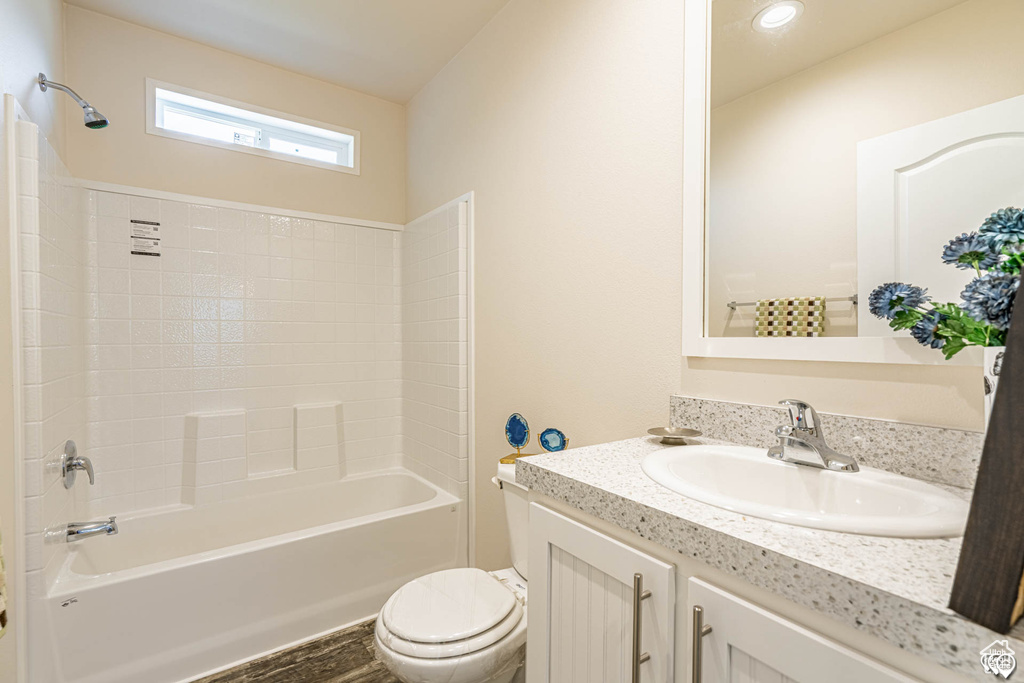 Full bathroom with shower / washtub combination, vanity, and toilet