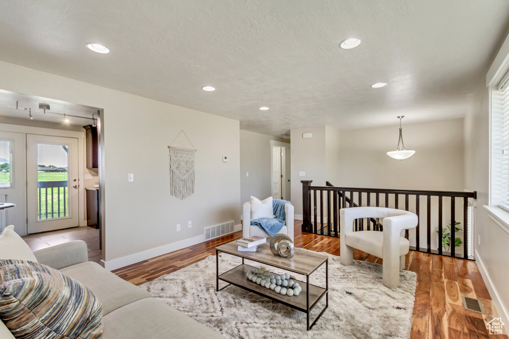 Living room with light wood-type flooring