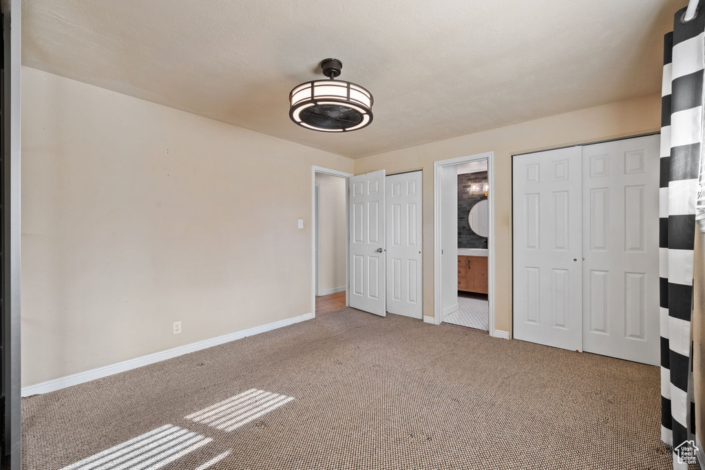 Unfurnished bedroom with carpet floors