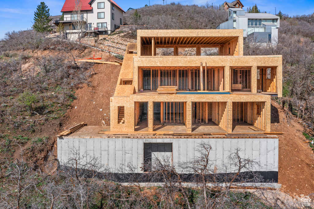 Rear view of property featuring a balcony