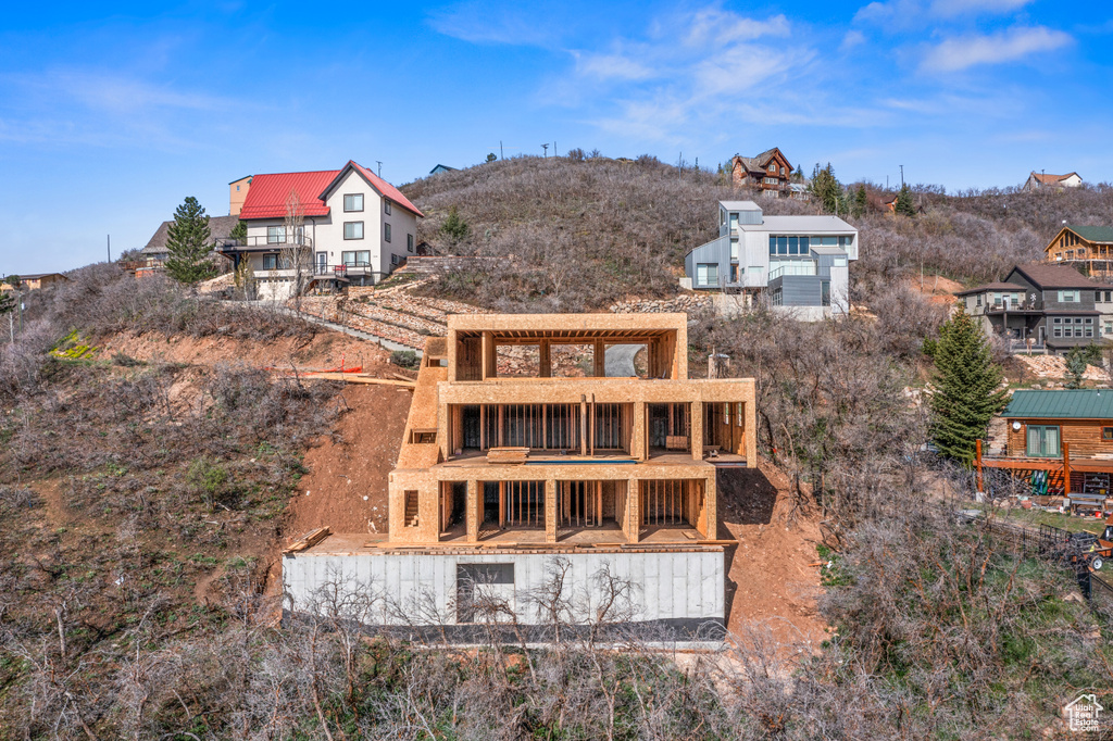 Back of property featuring a balcony