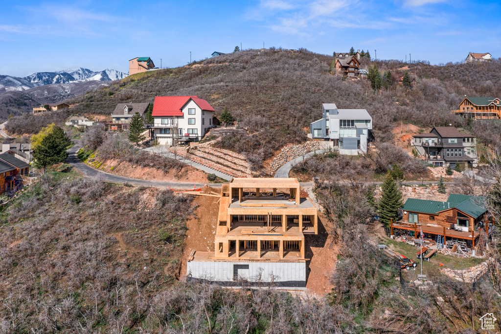 Birds eye view of property featuring a mountain view