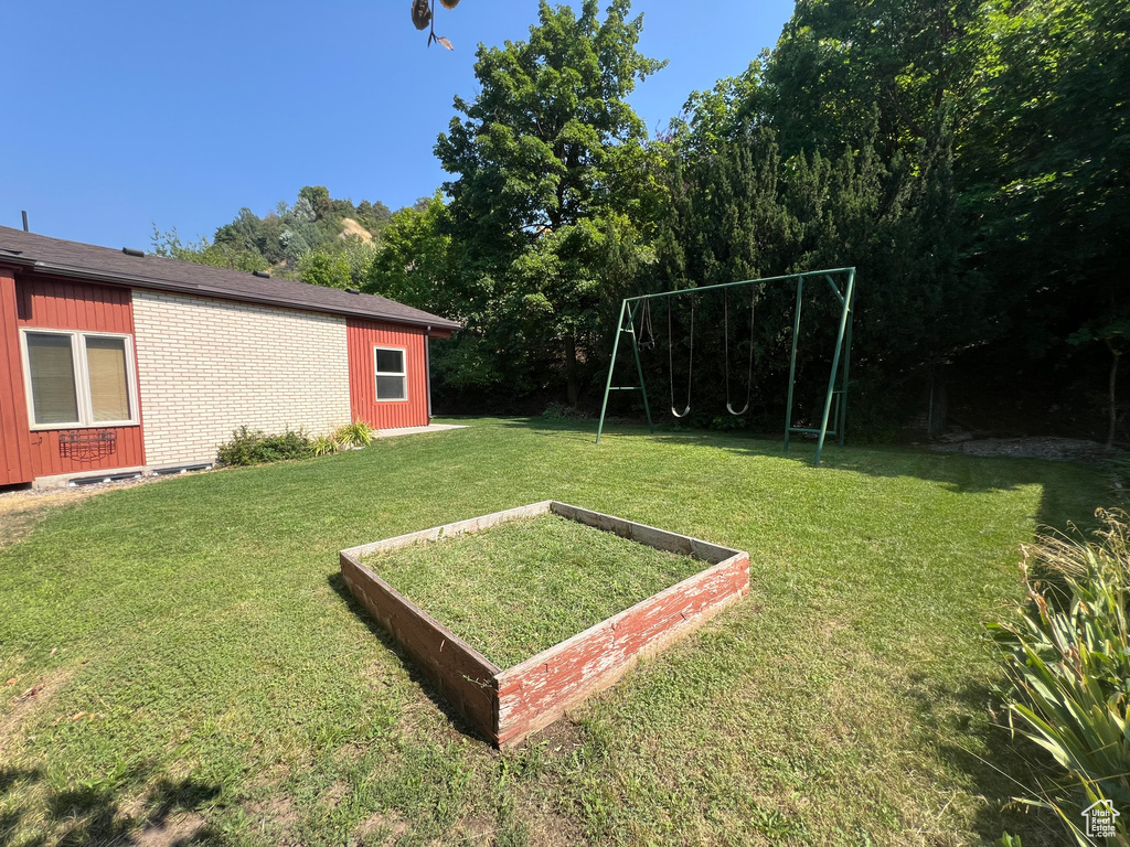 View of yard with a playground