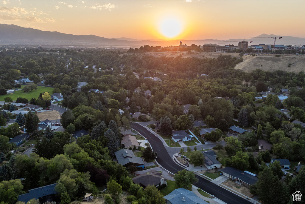 Aerial view at dusk featuring a mountain view