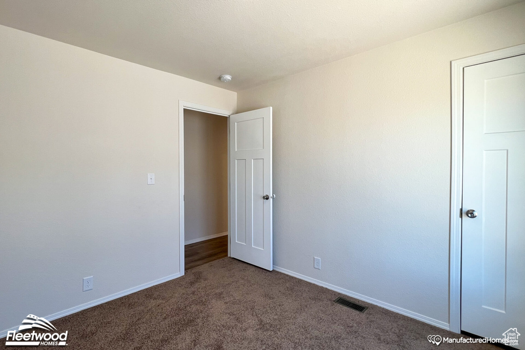 Unfurnished bedroom featuring carpet floors