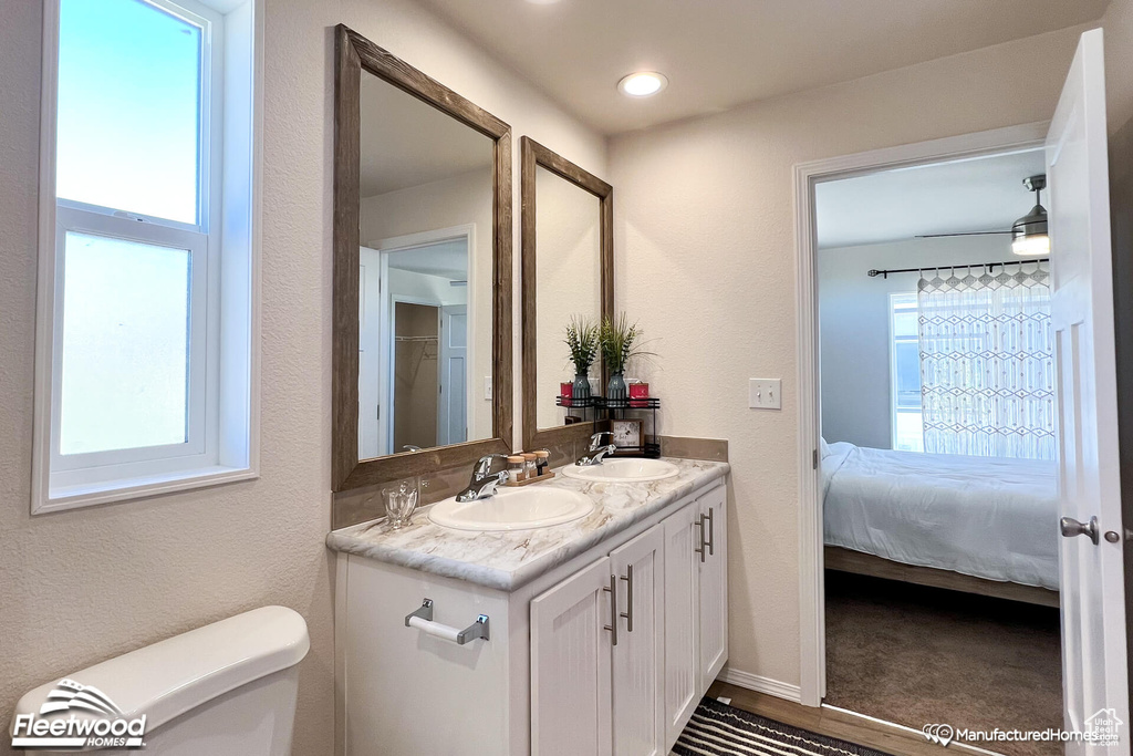 Bathroom with vanity and toilet