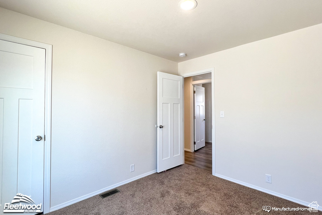 Unfurnished bedroom featuring carpet floors