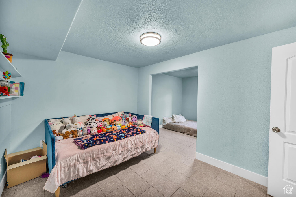 Bedroom with a textured ceiling