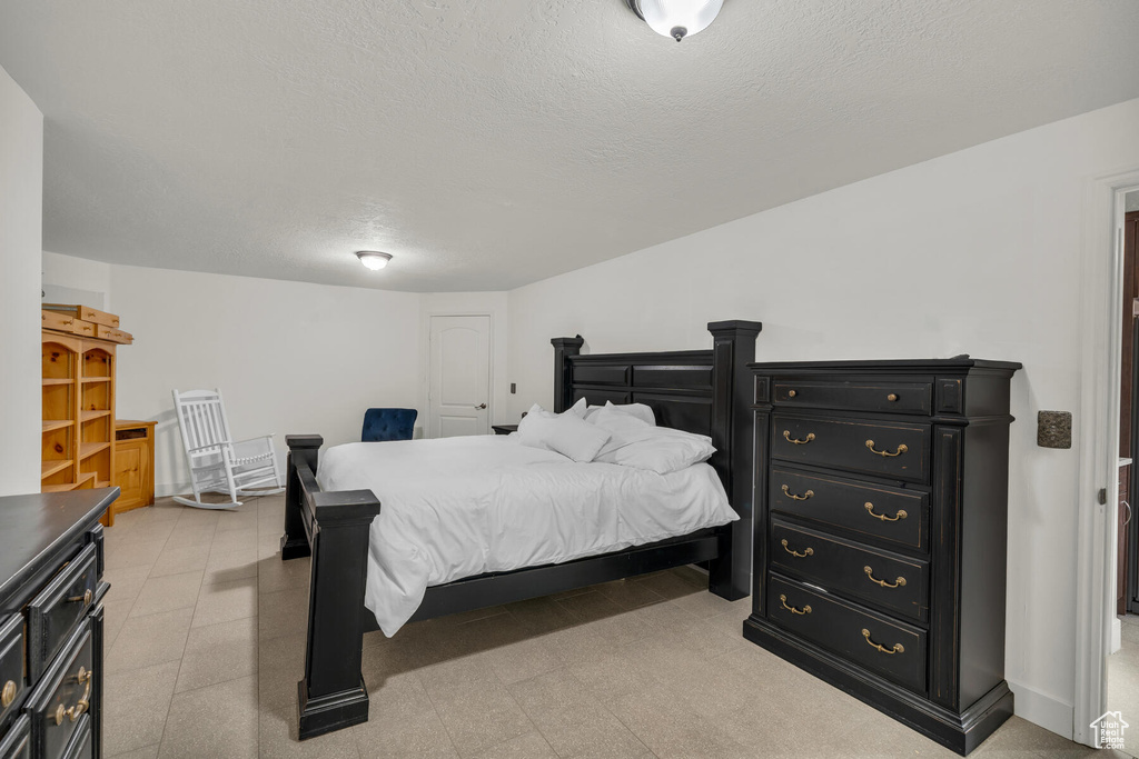 Bedroom with a textured ceiling