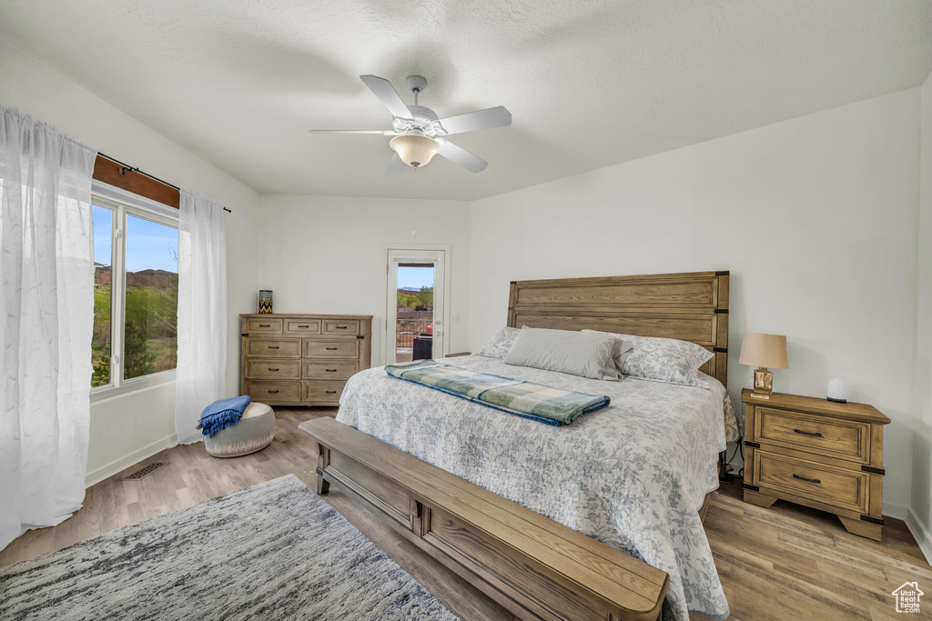 Bedroom with light wood-type flooring and ceiling fan