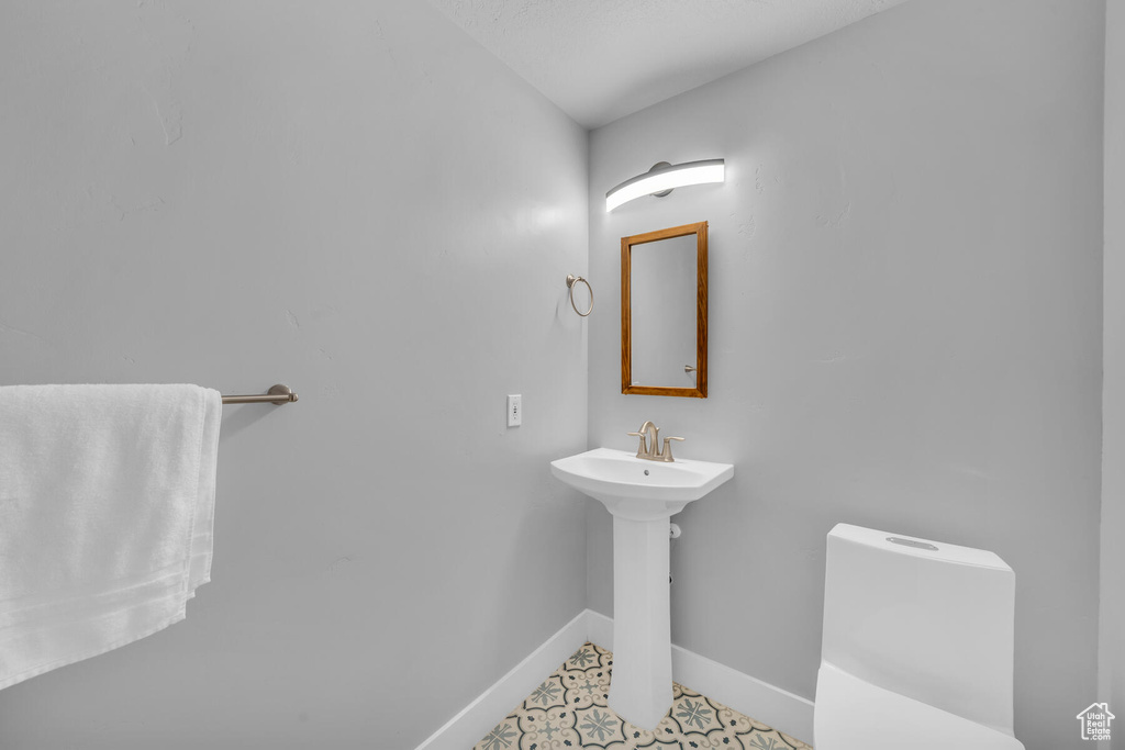 Bathroom featuring sink and tile patterned floors