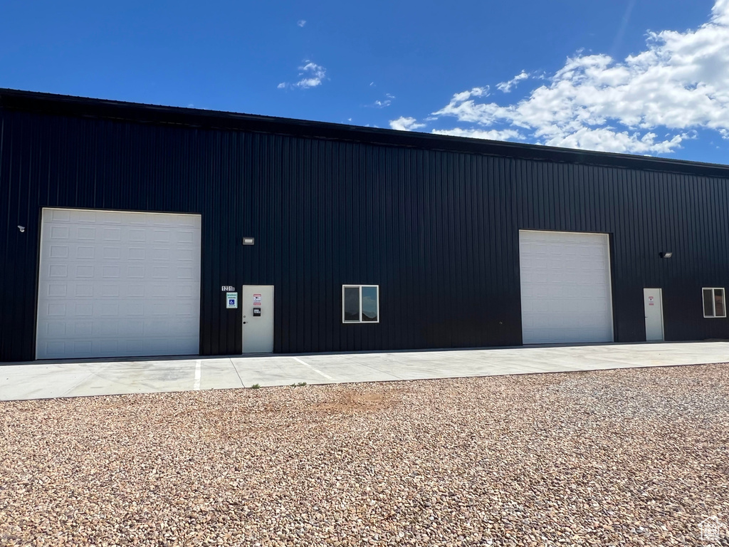 Exterior space featuring an outdoor structure and a garage