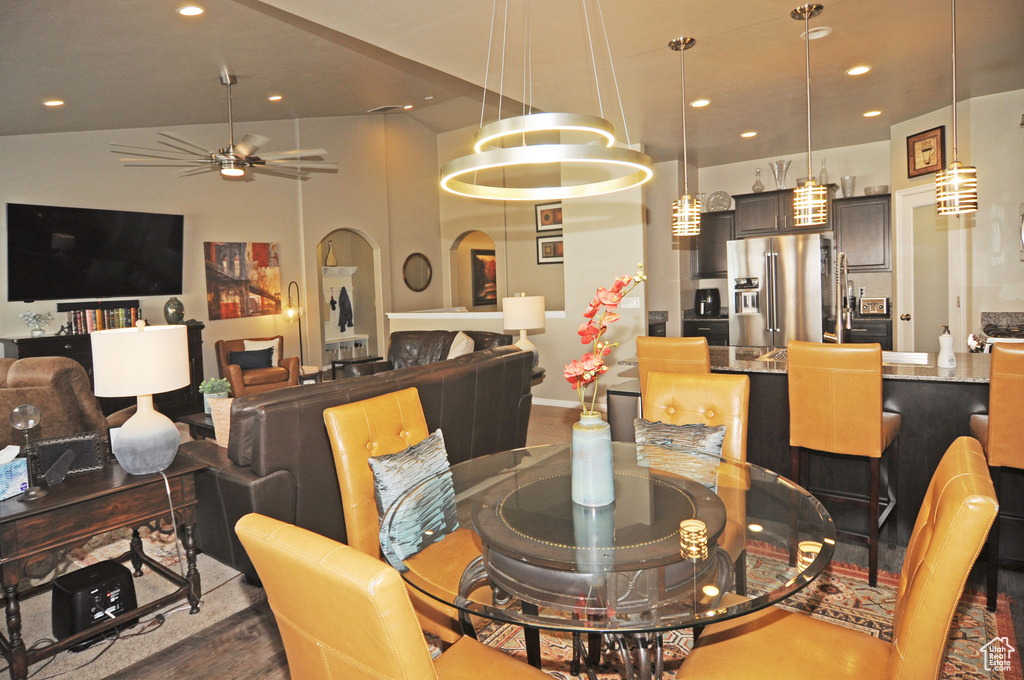 Dining room with ceiling fan and wood-type flooring