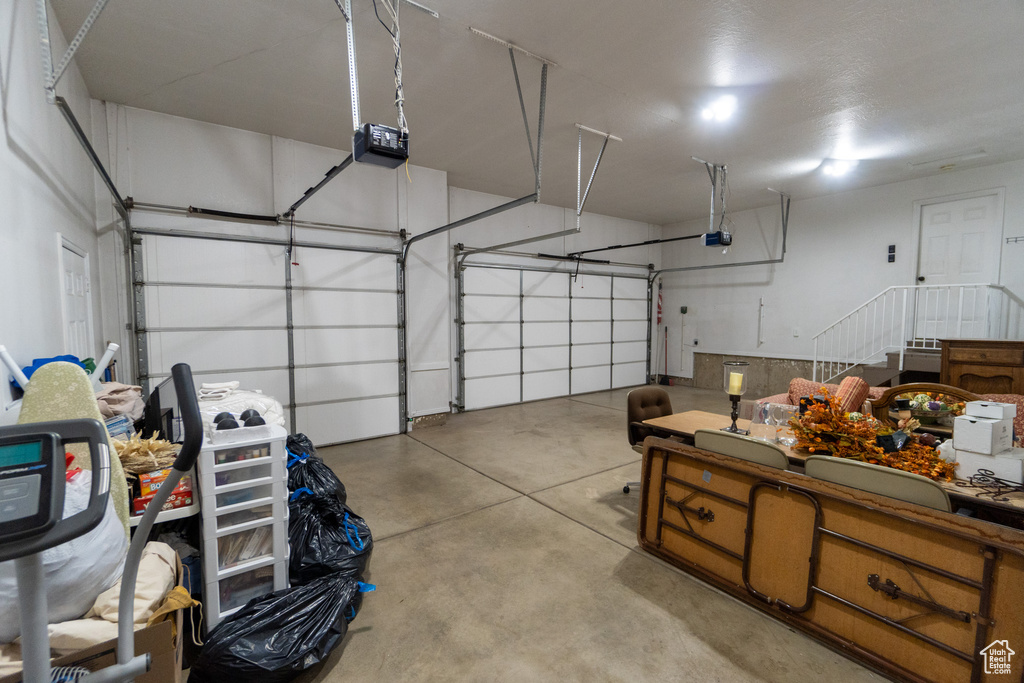 Garage featuring a garage door opener