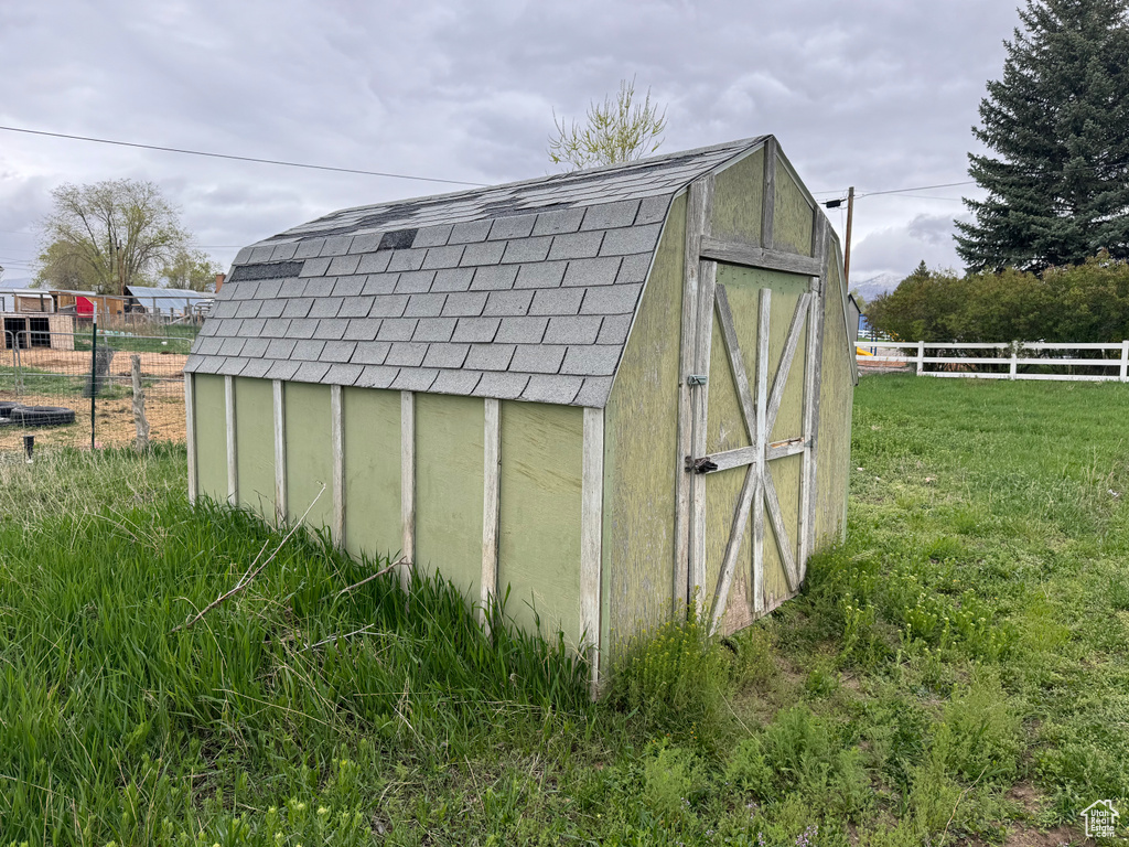 View of shed / structure with a lawn