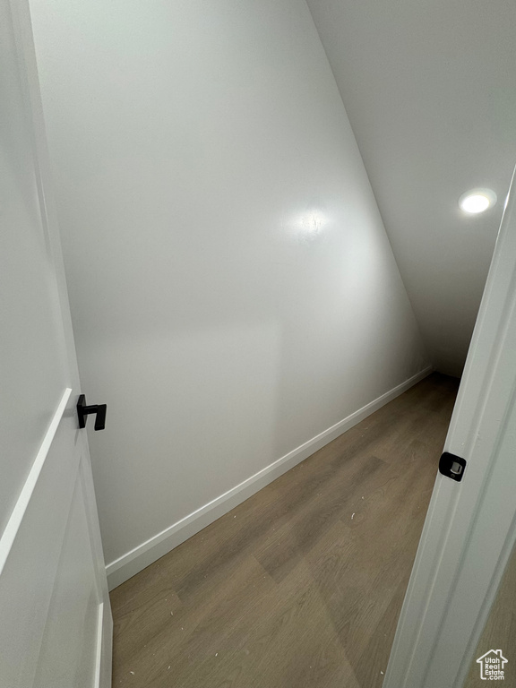 Interior space with recessed lighting, baseboards, and wood finished floors