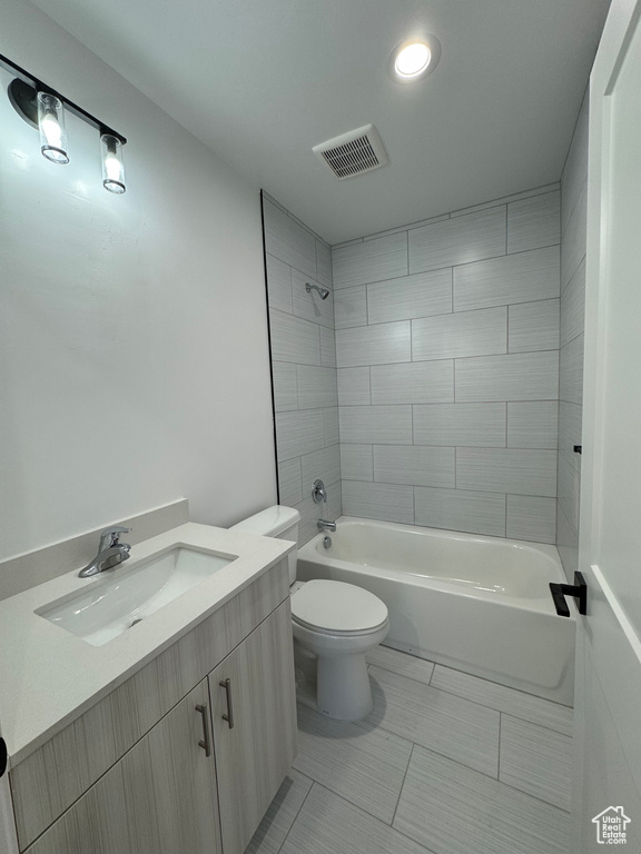 Full bathroom with recessed lighting, toilet, visible vents, vanity, and washtub / shower combination