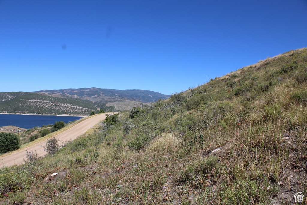 Mountain view featuring a water view