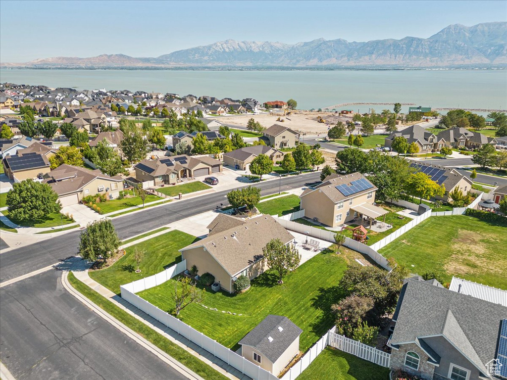 Drone / aerial view with a water and mountain view