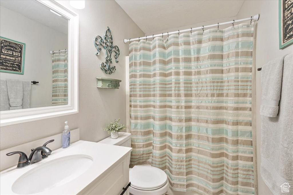 Bathroom featuring toilet and vanity