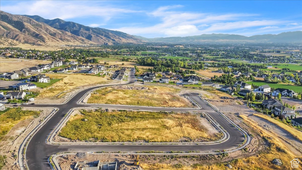 Birds eye view of property with a mountain view