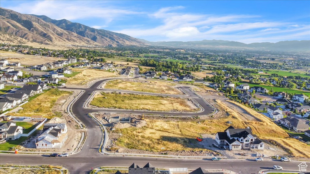 Birds eye view of property with a mountain view